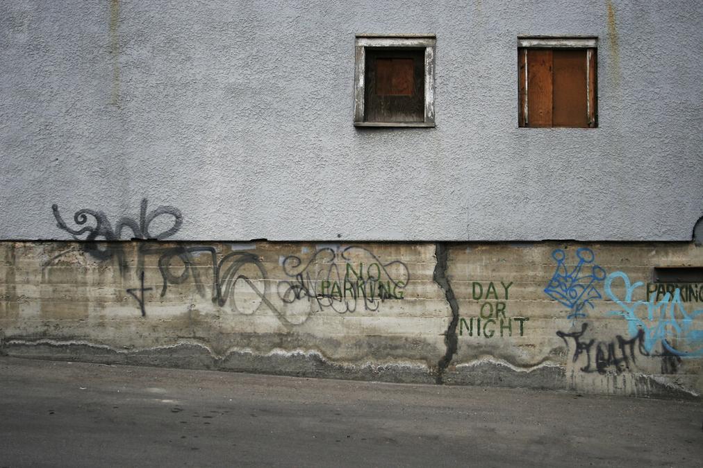 Day Or Night - a wall with graffiti on it